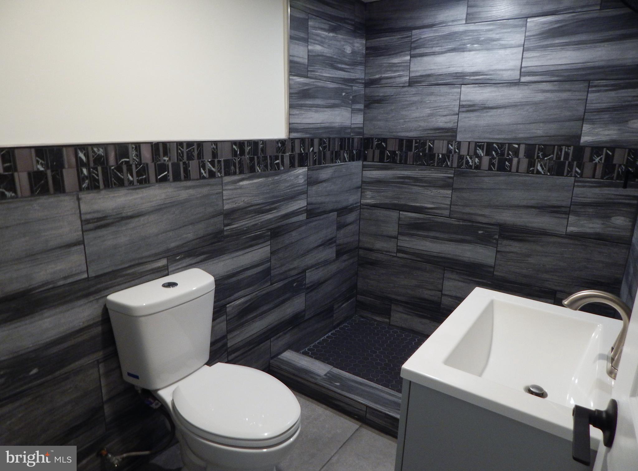 1923 Ashley Road Philadelphia, PA 19138 - Photo 18 of 23 Lower Level Ceramic Tile Full Bath