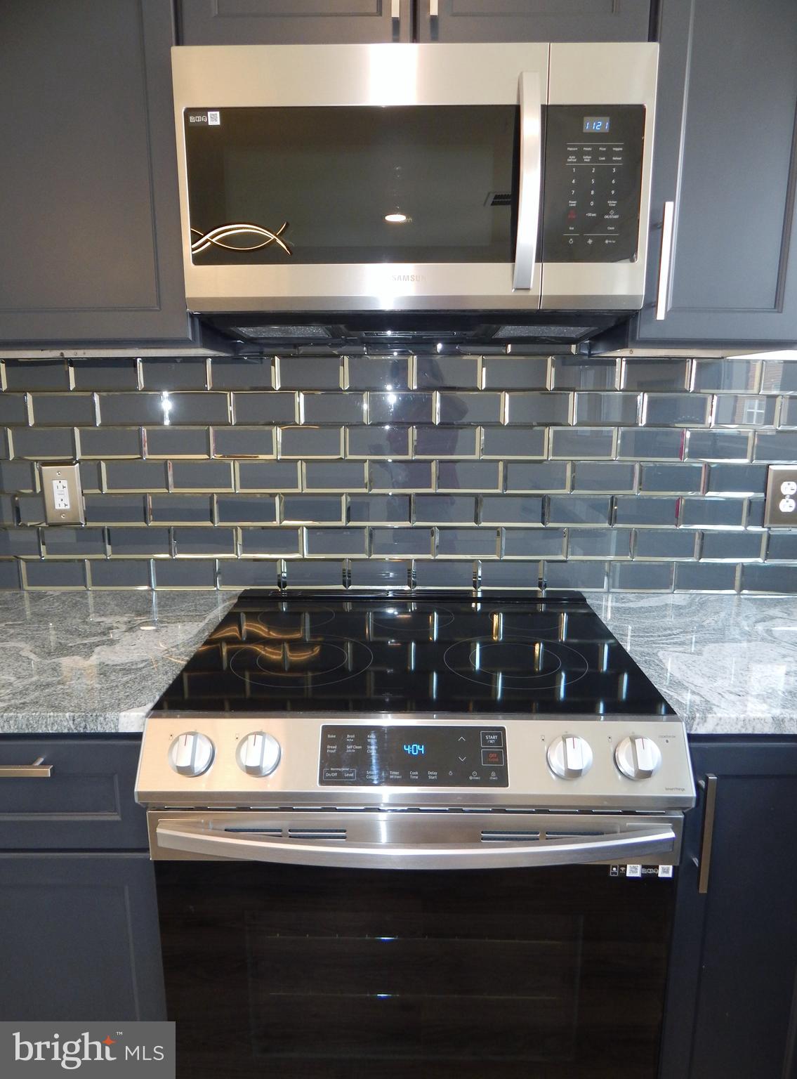 1923 Ashley Road Philadelphia, PA 19138 - Photo 7 of 23 Built in Microwave and Glass Tile Backsplash