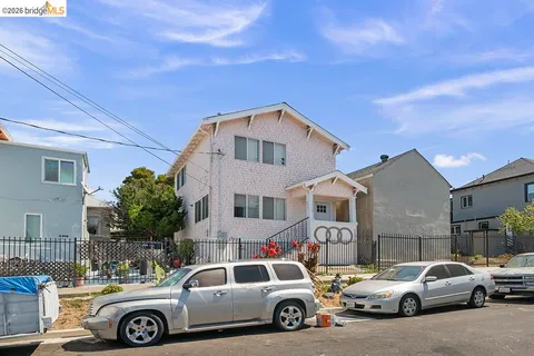 a front view of a house with parking space