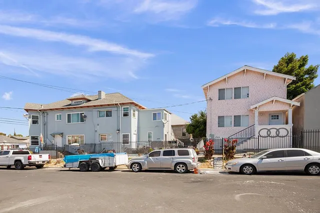 a view of a city street with cars