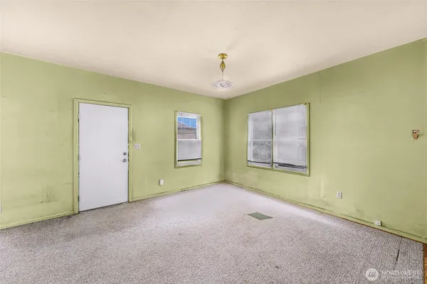 a view of an empty room with a window