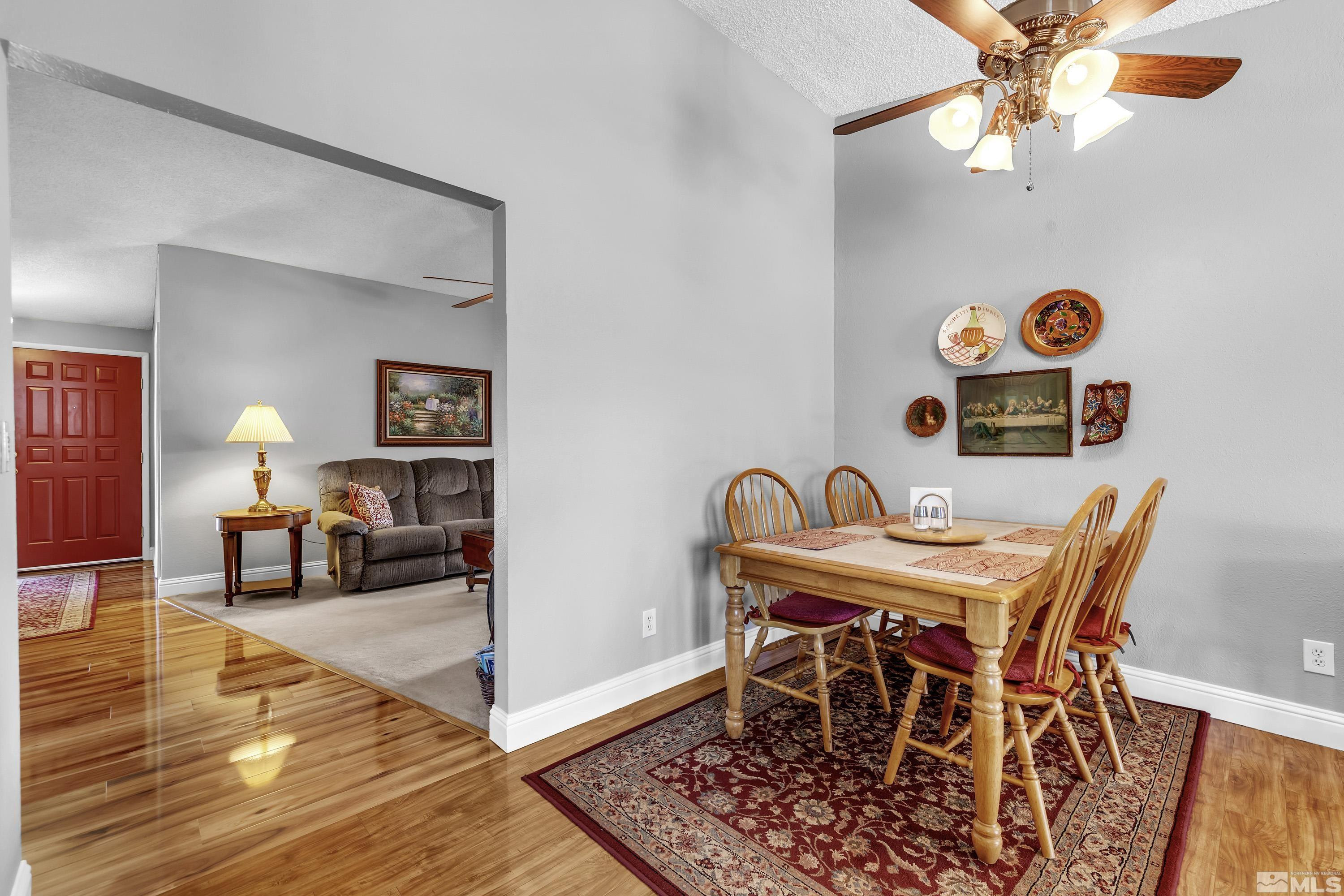 4900 Spring Drive Reno, NV 89502 - Photo 16 of 34 a view of a dining room with furniture and wooden floor