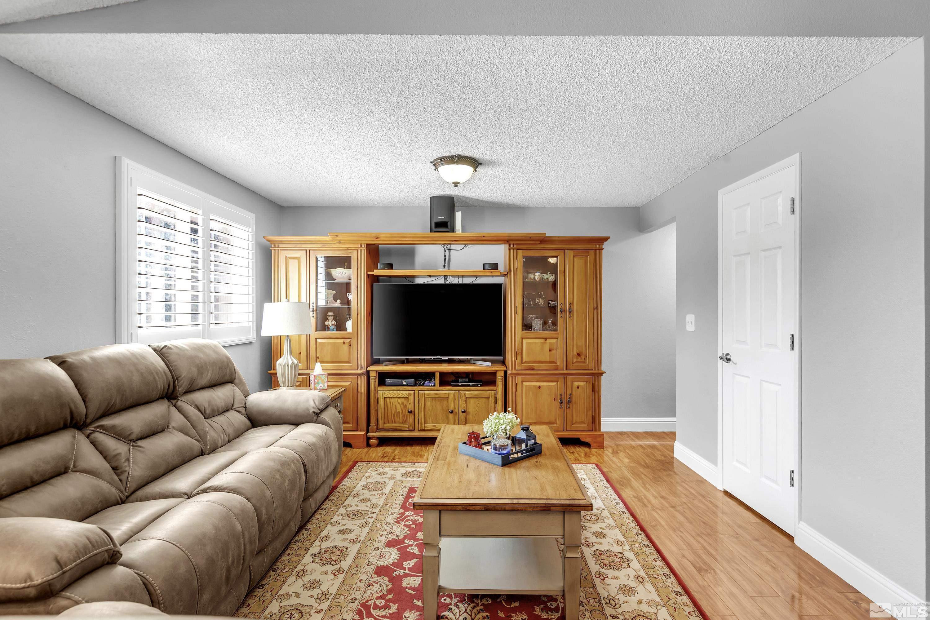 4900 Spring Drive Reno, NV 89502 - Photo 22 of 34 a living room with furniture and a flat screen tv