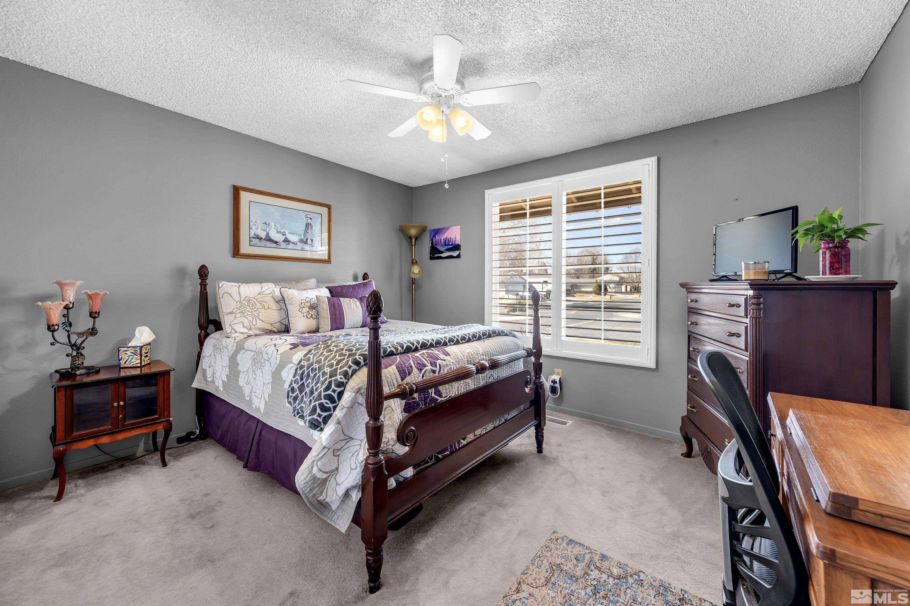 4900 Spring Drive Reno, NV 89502 - Photo 25 of 34 a bedroom with a bed chair and a window