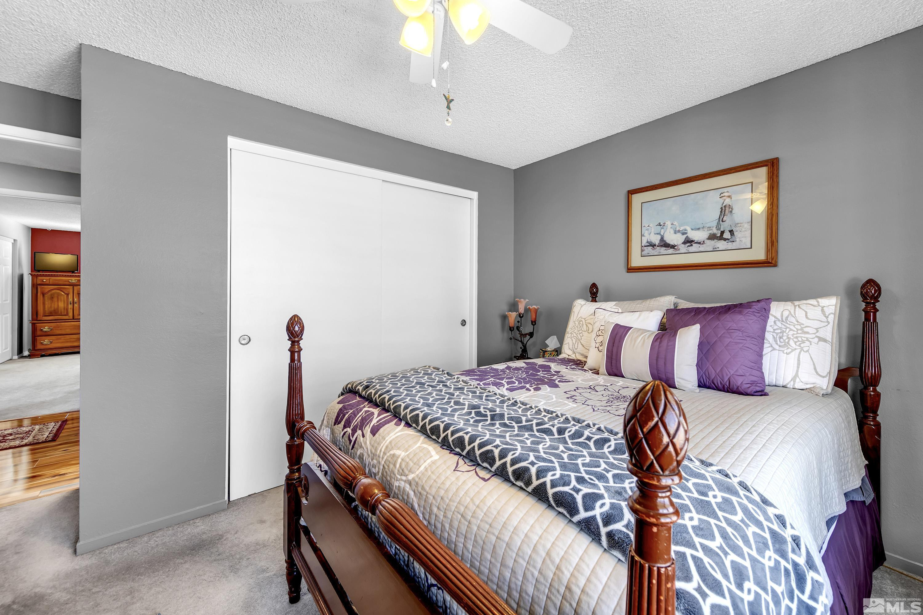 4900 Spring Drive Reno, NV 89502 - Photo 26 of 34 a bedroom with a bed and a chandelier