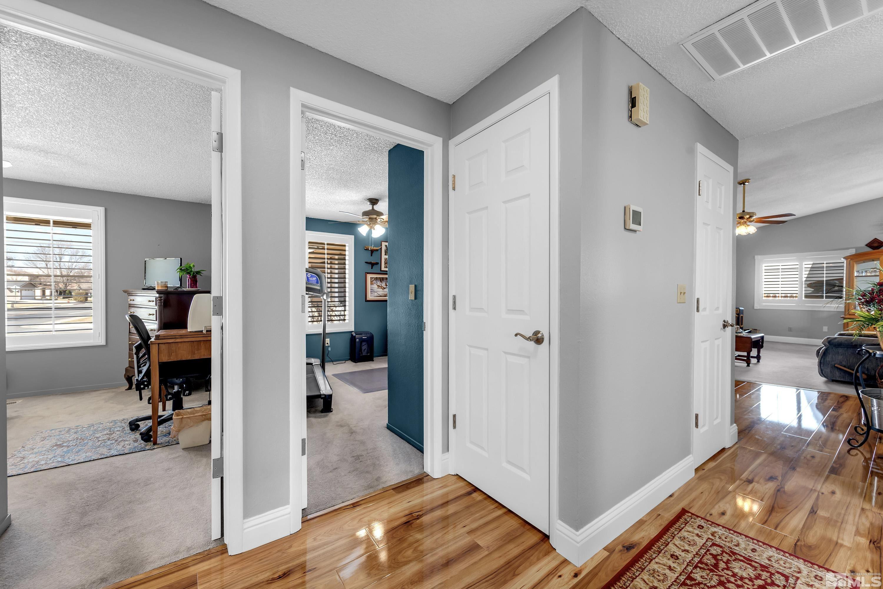 4900 Spring Drive Reno, NV 89502 - Photo 30 of 34 a view of a livingroom with wooden floor and a bedroom