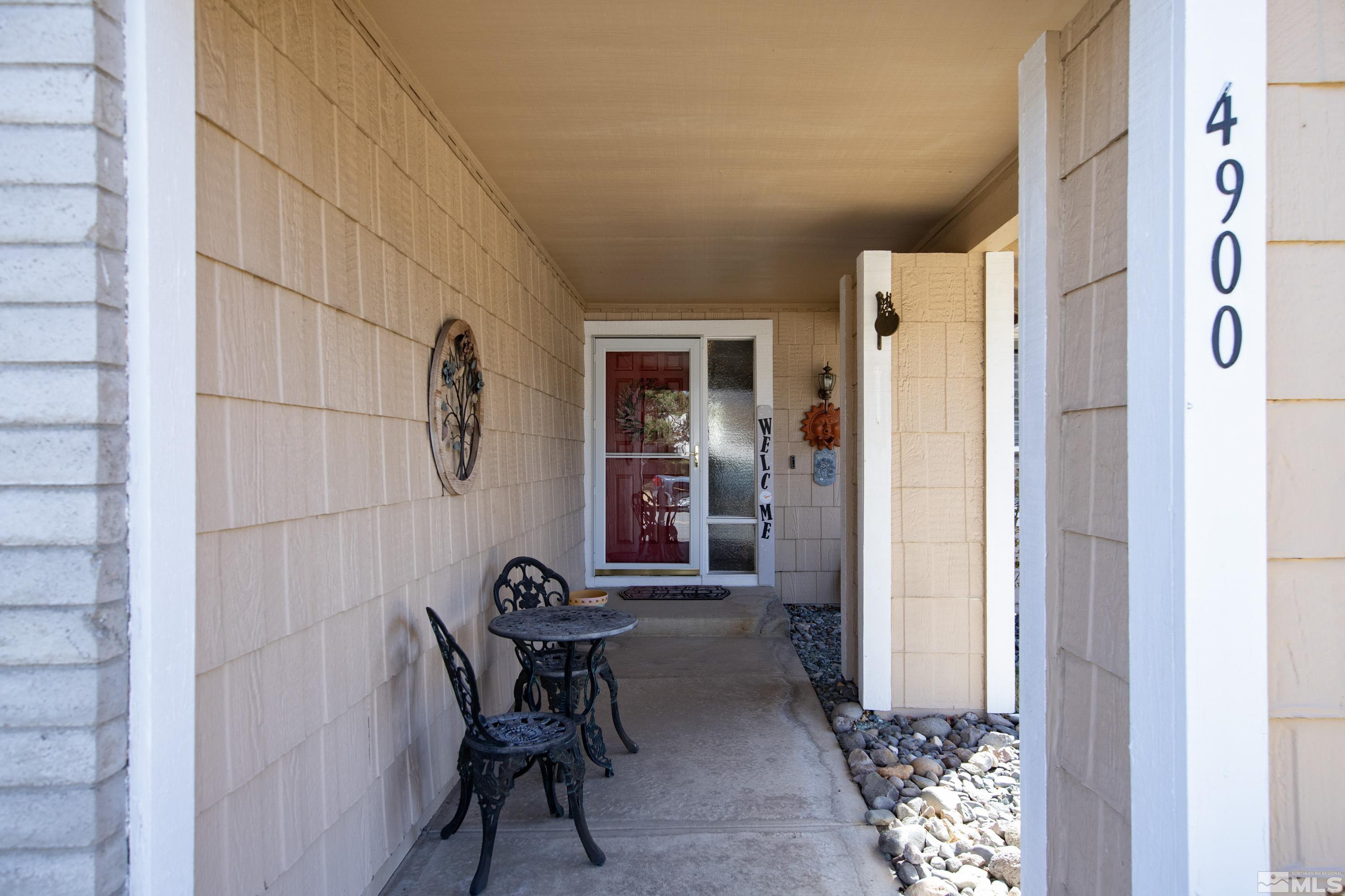 4900 Spring Drive Reno, NV 89502 - Photo 4 of 34 a view of a hallway to a livingroom with furniture and a window