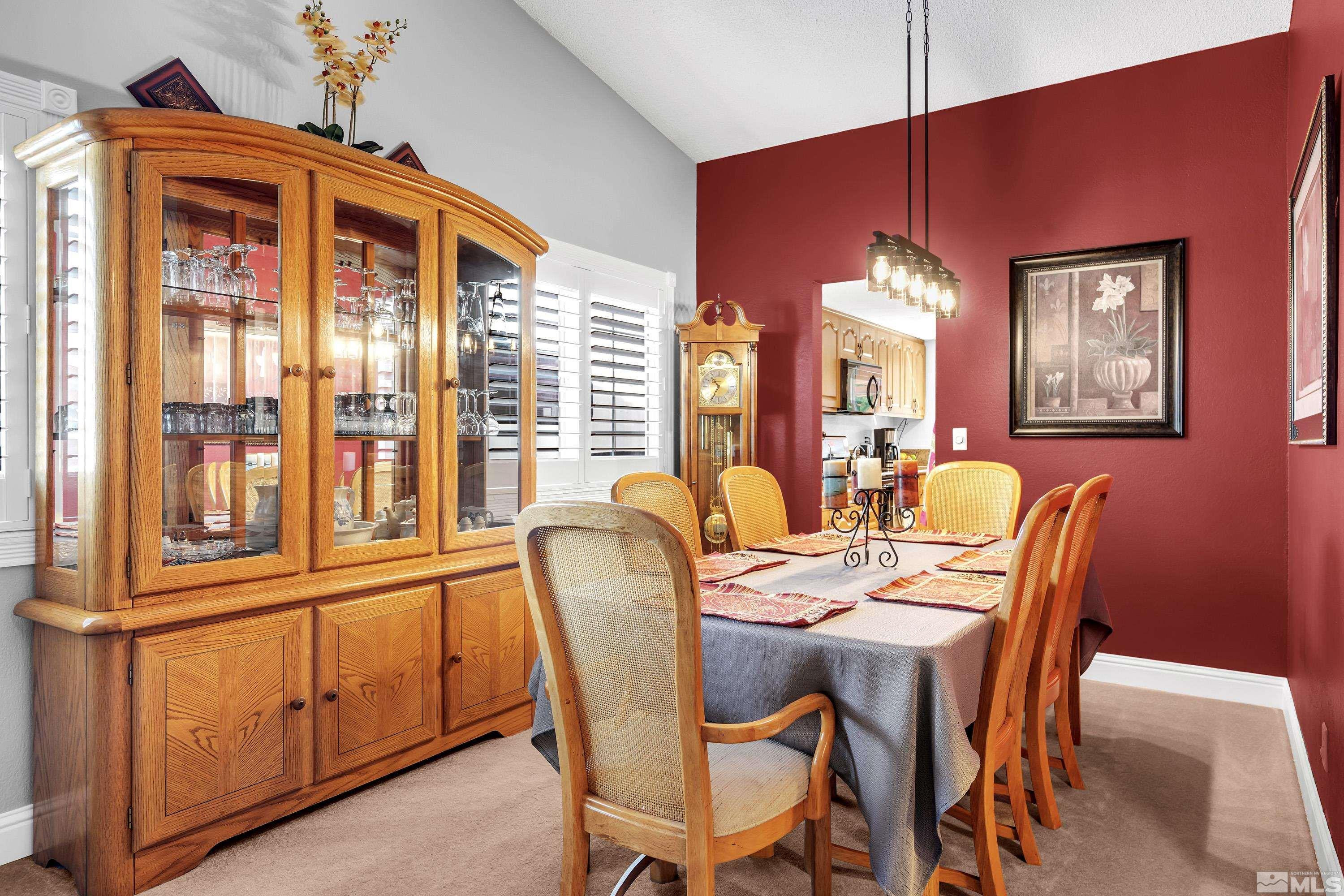 4900 Spring Drive Reno, NV 89502 - Photo 7 of 34 a dining room with furniture a chandelier and window