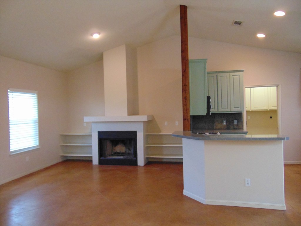 Undisclosed Address Dripping Springs, TX 78620 - Photo 3 of 14 a living room with stainless steel appliances granite countertop furniture and a fireplace