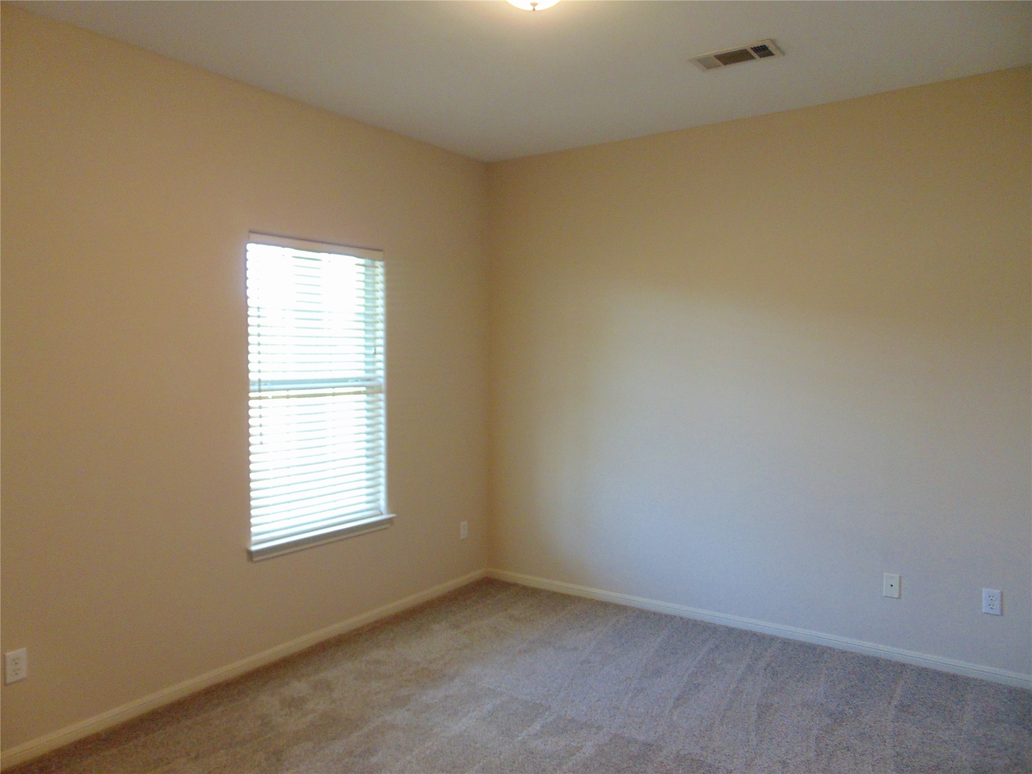 100 Chestnut Ridge, Unit A Dripping Springs, TX 78620 - Photo 8 of 14 an empty room with a window