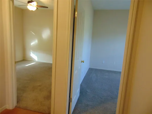 a view of a bathroom from a hallway