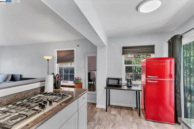 a kitchen with stainless steel appliances granite countertop a stove and a refrigerator