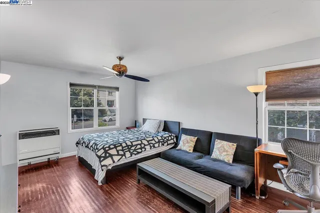 a bedroom with furniture and a window