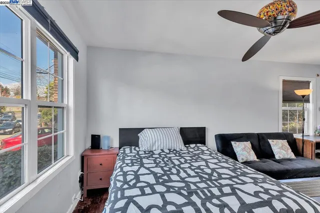 a bedroom with a bed and window