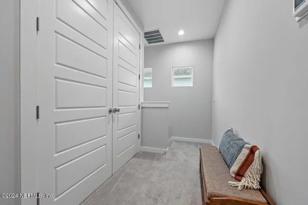 a view of a hallway with closet