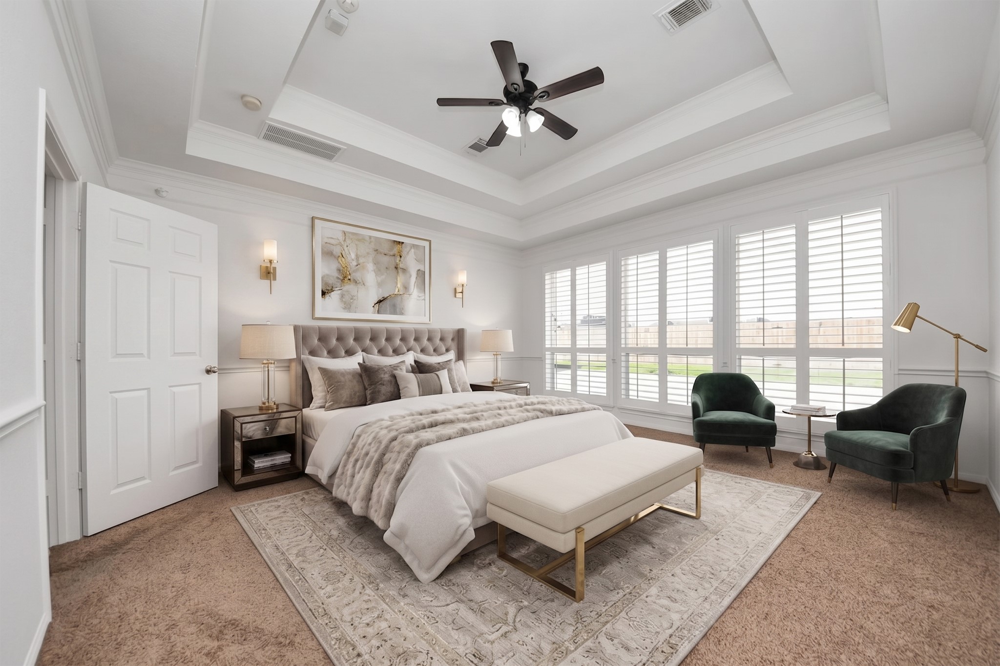 20111 Biscayne Hill Court Spring, TX 77379 - Photo 20 of 44 This spacious bedroom features a cozy bed with plush bedding, elegant nightstands, and ample natural light from large windows with shutters. It includes a stylish sitting area with two green chairs and a bench, complemented by a neutral color palette and a ceiling fan.