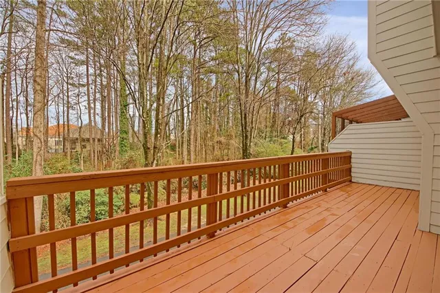 a view of wooden balcony with wooden floor and fence