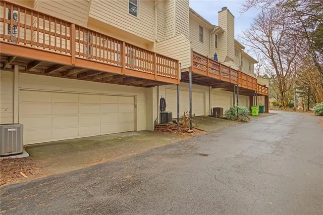 a view of a house with basketball court