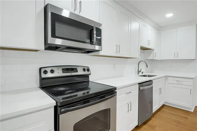 a kitchen with a stove and a microwave