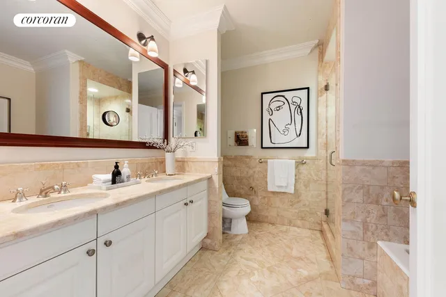 a bedroom with a bed and a potted plant