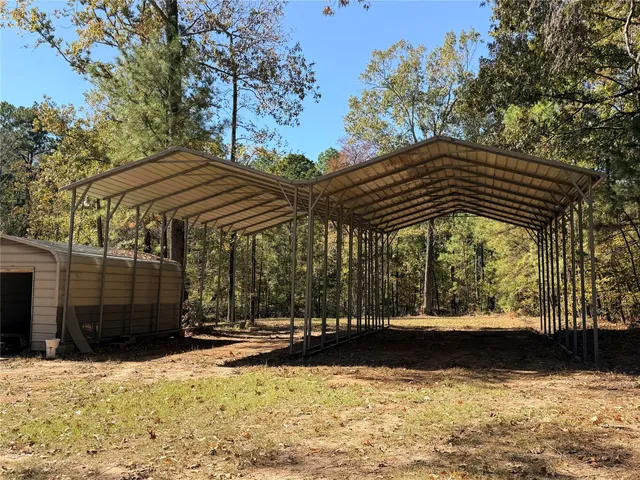 a kitchen with stainless steel appliances granite countertop a stove a refrigerator and a microwave