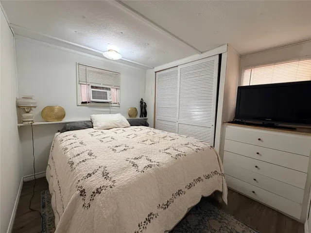 a view of a backyard with table and chairs and a fire pit