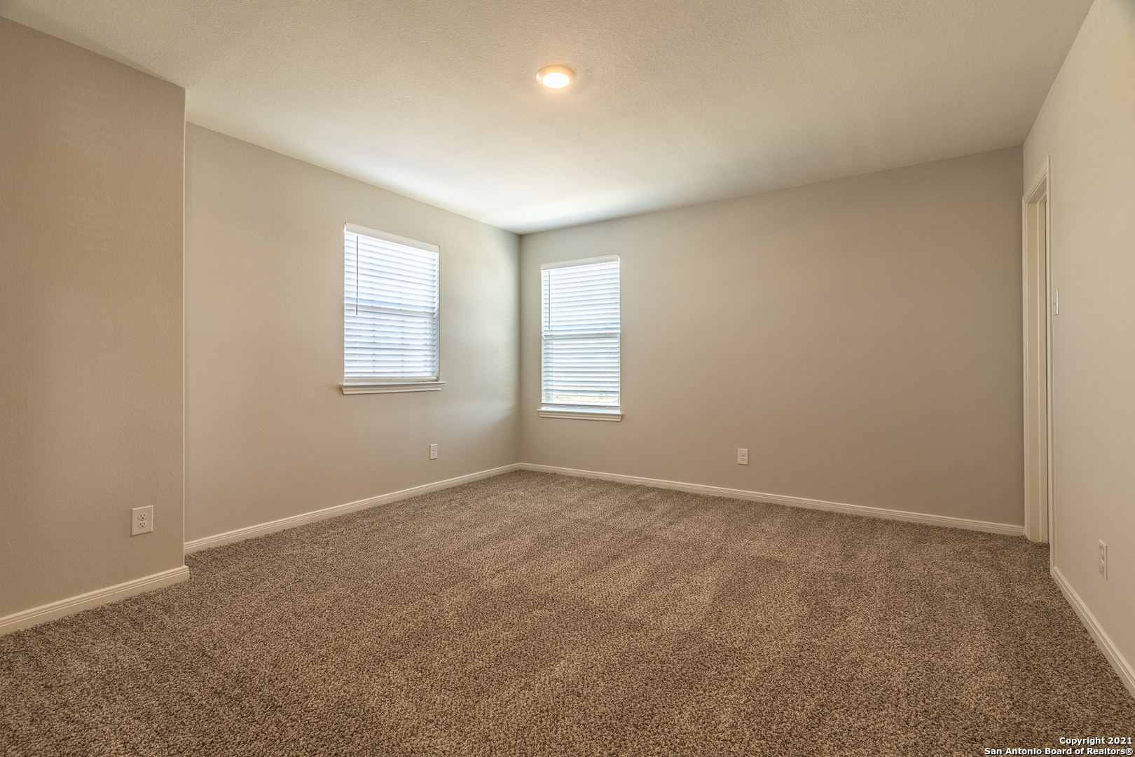 9338 Espadrille Run Converse, TX 78109 - Photo 35 of 46 an empty room with windows