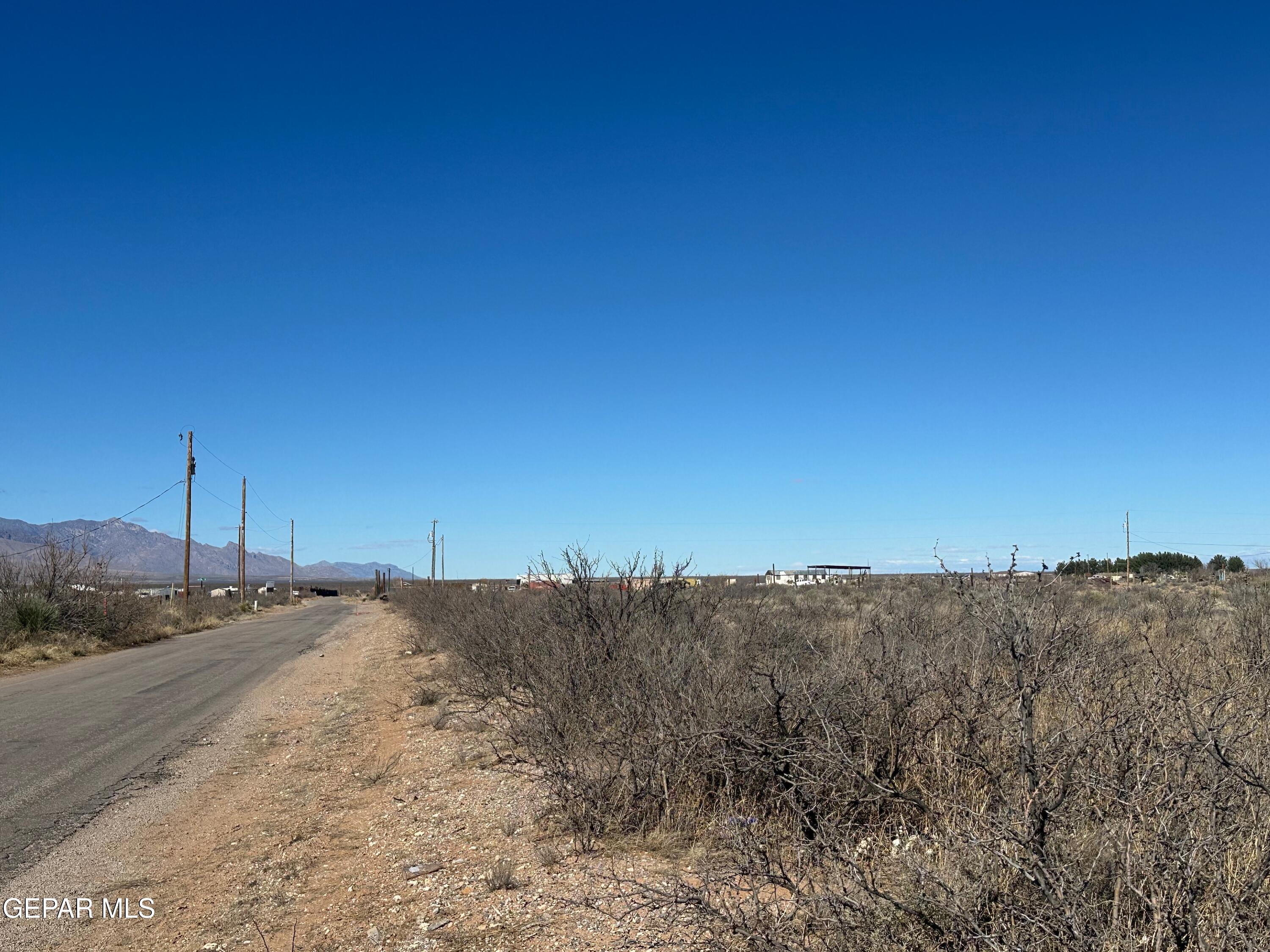 1052 Shiprock Road Chaparral, NM 88081 - Photo 5 of 6 a view of a road with a ocean view