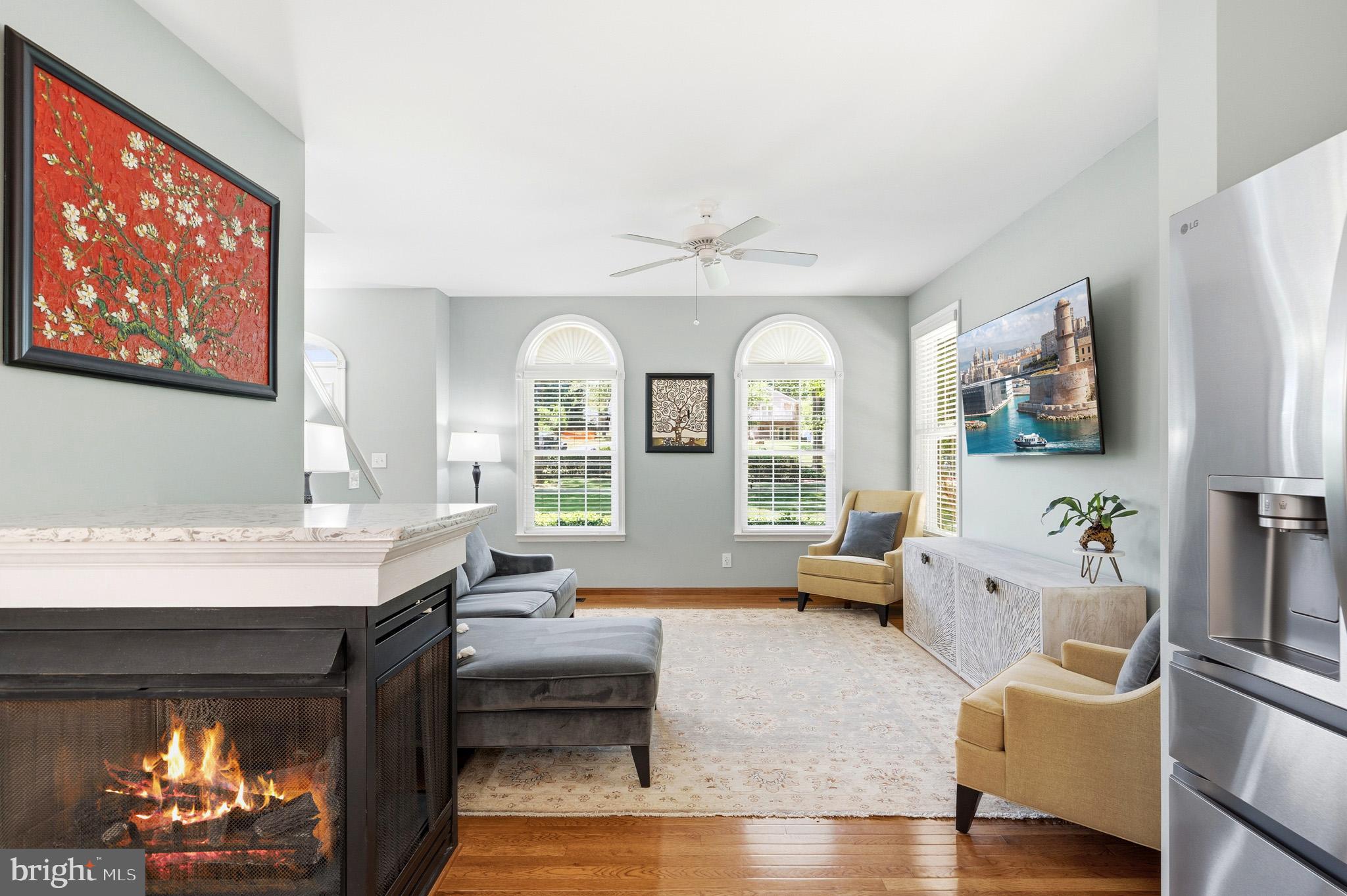 3148 Holland Cliffs Road Huntingtown, MD 20639 - Photo 11 of 61 Bright and inviting with a cozy fireplace!