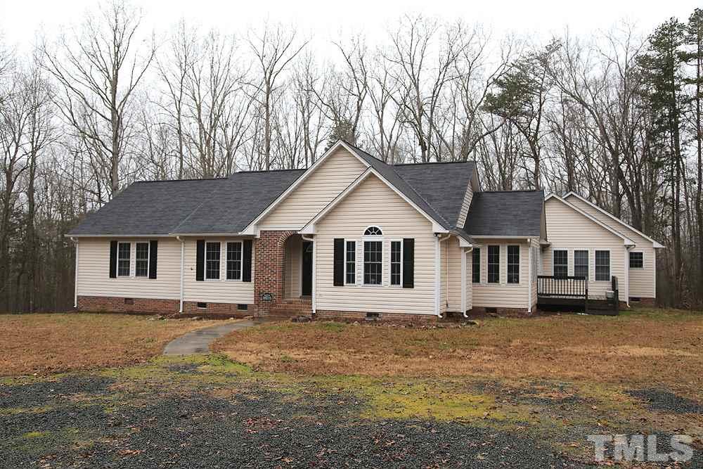 657 Thunder Road Rougemont, NC 27572 - Photo 1 of 29 a front view of a house with a yard and trees