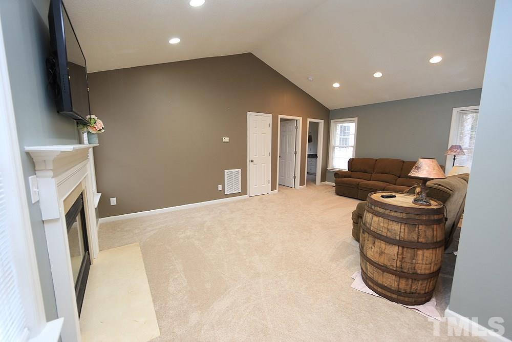 657 Thunder Road Rougemont, NC 27572 - Photo 15 of 29 a living room with furniture and a flat screen tv