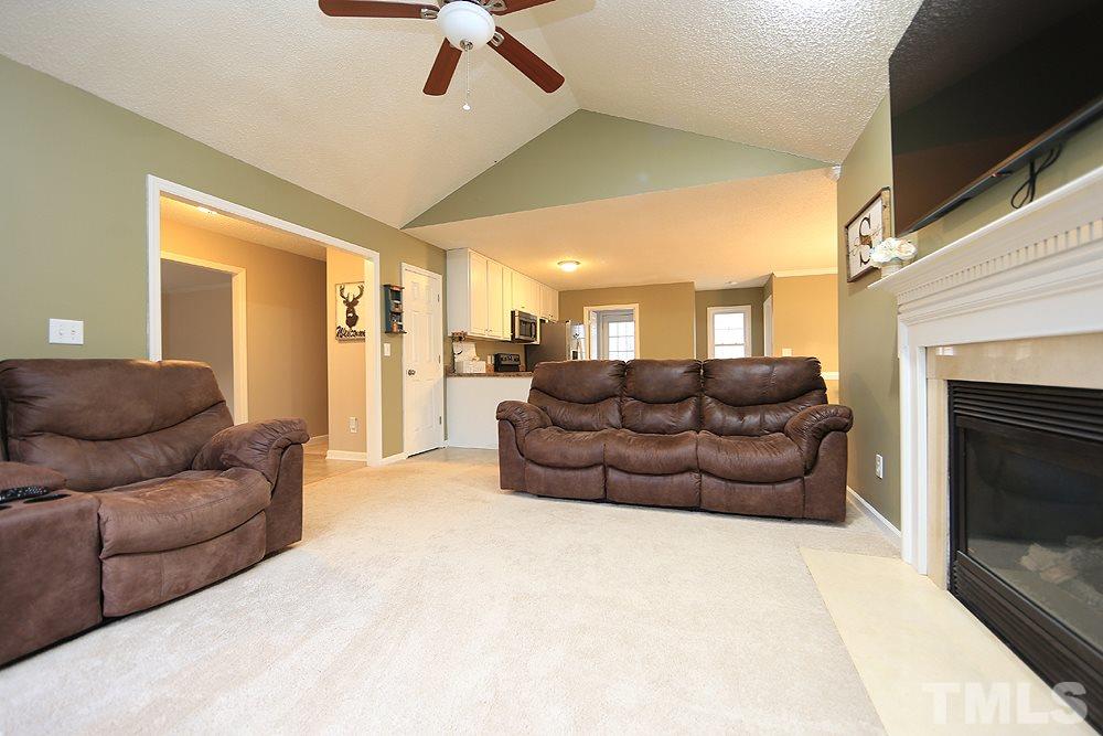657 Thunder Road Rougemont, NC 27572 - Photo 3 of 29 a living room with furniture and a fireplace