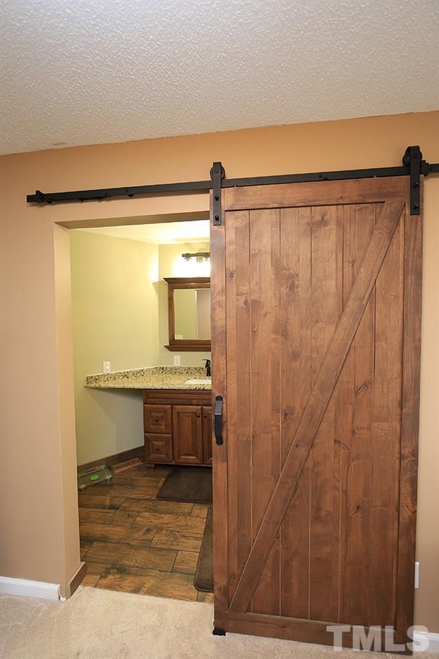 657 Thunder Road Rougemont, NC 27572 - Photo 21 of 29 a bathroom with a shower and a sink
