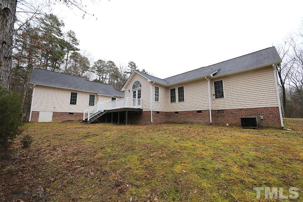 657 Thunder Road Rougemont, NC 27572 - Photo 27 of 29 a white house that has a tree in front of it