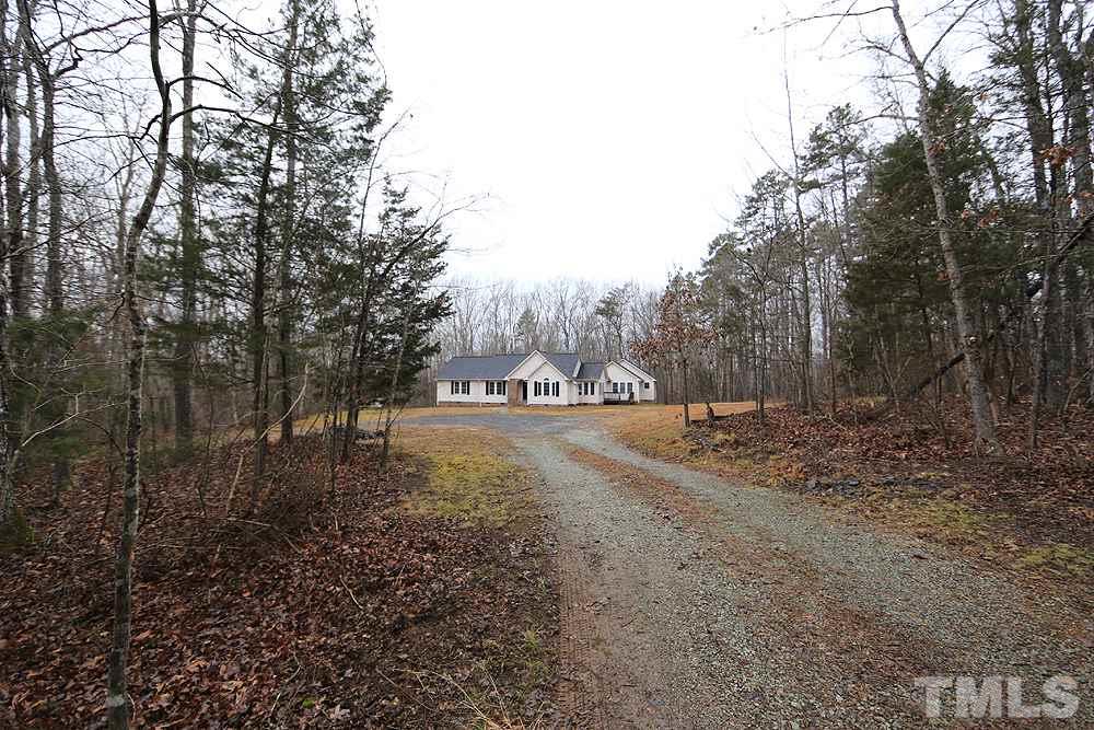 657 Thunder Road Rougemont, NC 27572 - Photo 6 of 29 a view of dirt field with trees in the background
