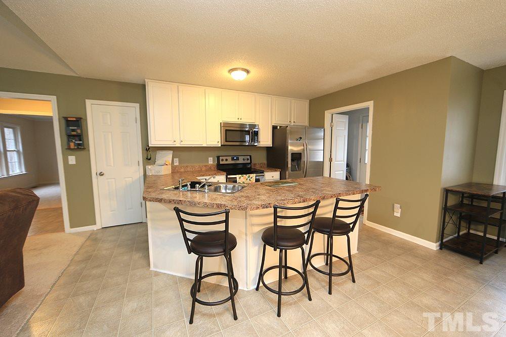 657 Thunder Road Rougemont, NC 27572 - Photo 10 of 29 a view of a dining room with furniture and a chandelier