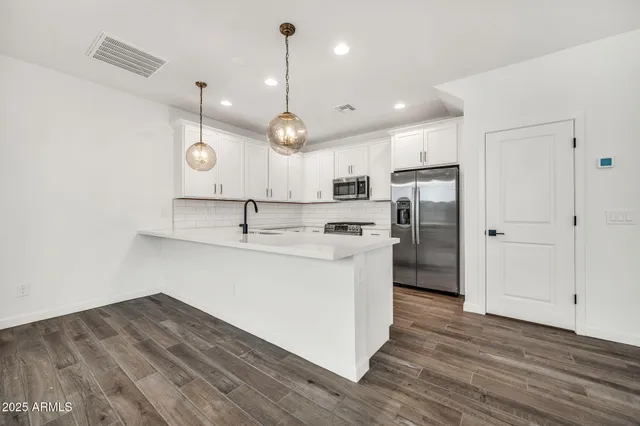 a bathroom with a double vanity sink mirror and double