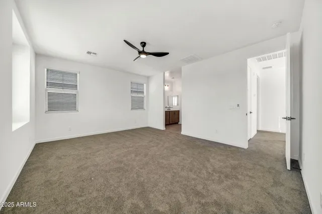 a bedroom with bed and a window