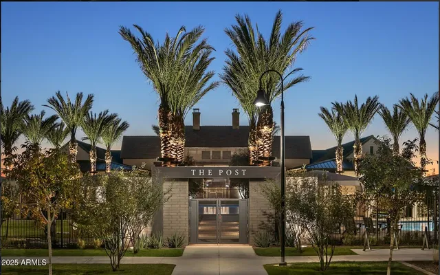 a very nice looking dining room with furniture and chandelier