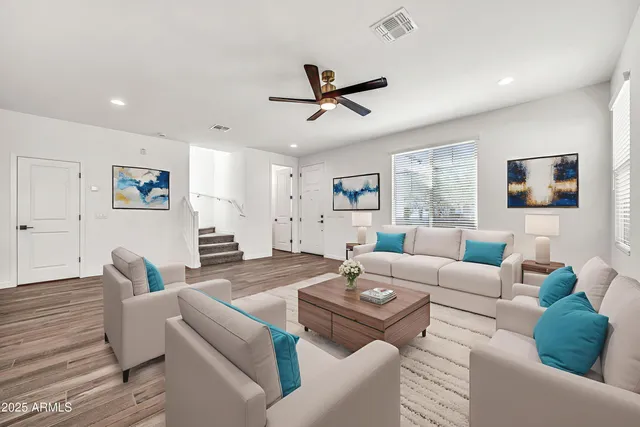a view of kitchen with wooden floor and electronic appliances