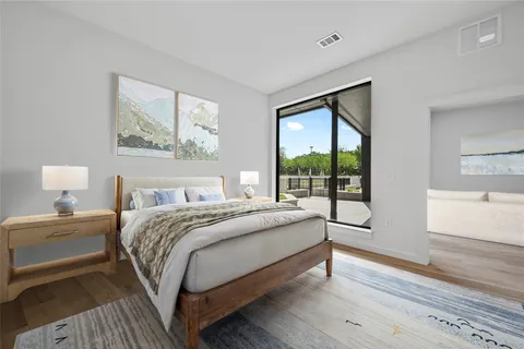 a bedroom with a large bed and a window