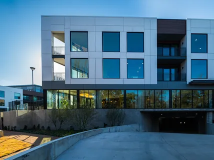 a view of swimming pool with outdoor seating and plants
