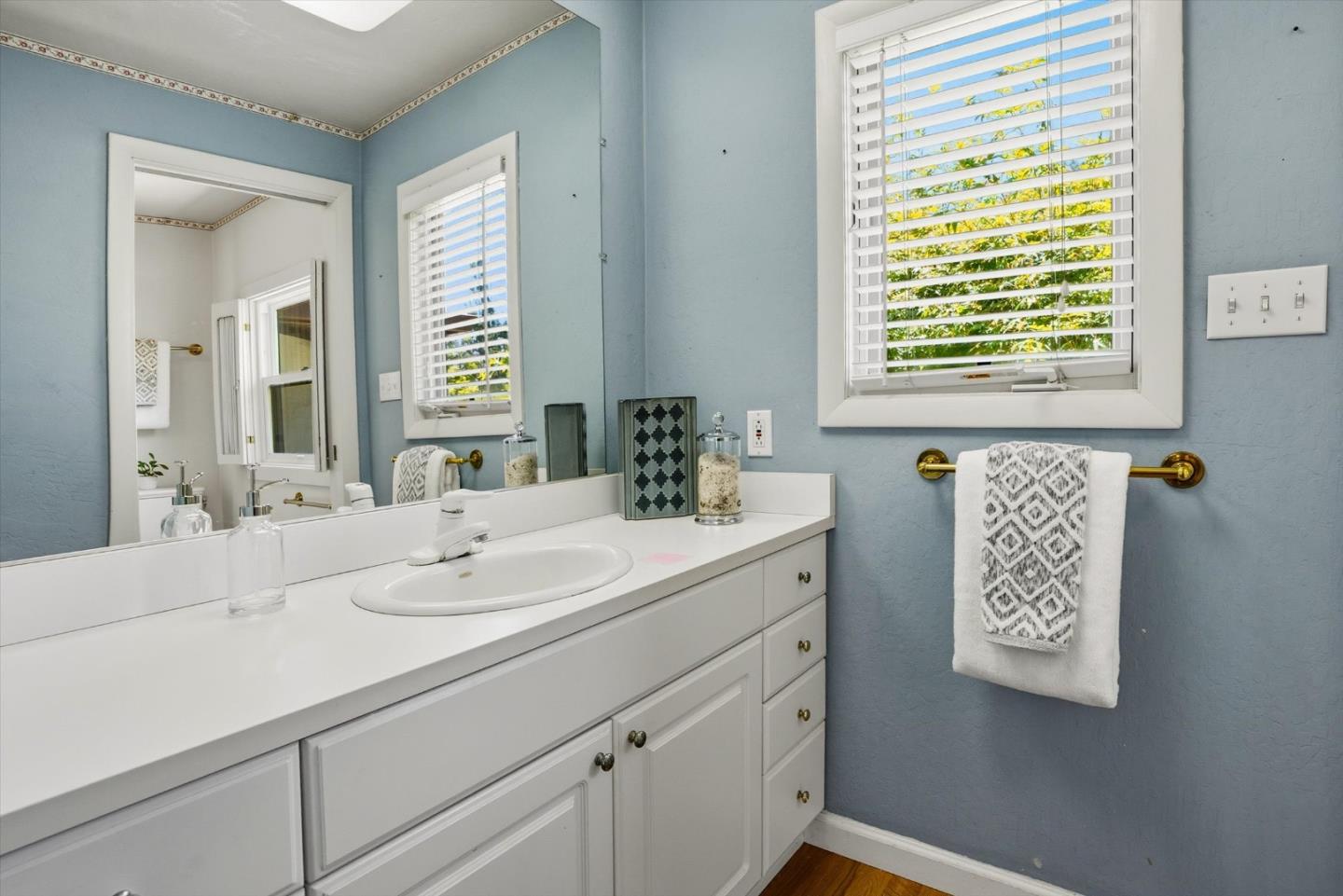 16899 Kennedy Road Los Gatos, CA 95032 - Photo 48 of 61 a bathroom with a sink and a mirror