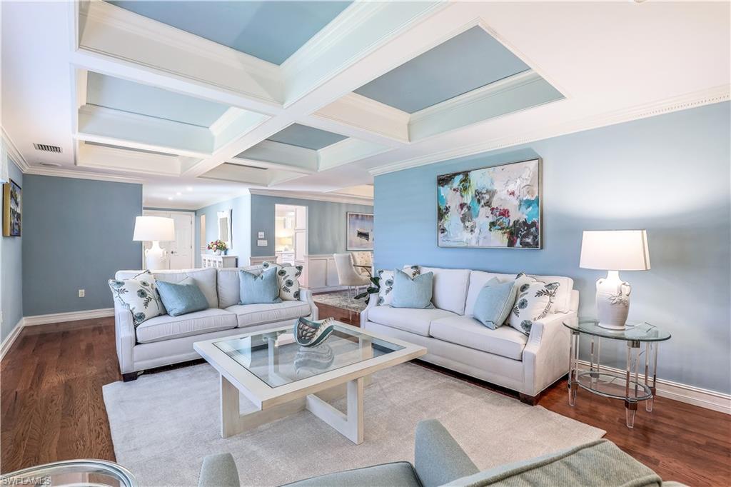 635 Anchor Rode Drive Naples, FL 34103 - Photo 11 of 50 a living room with furniture and a painting on the wall