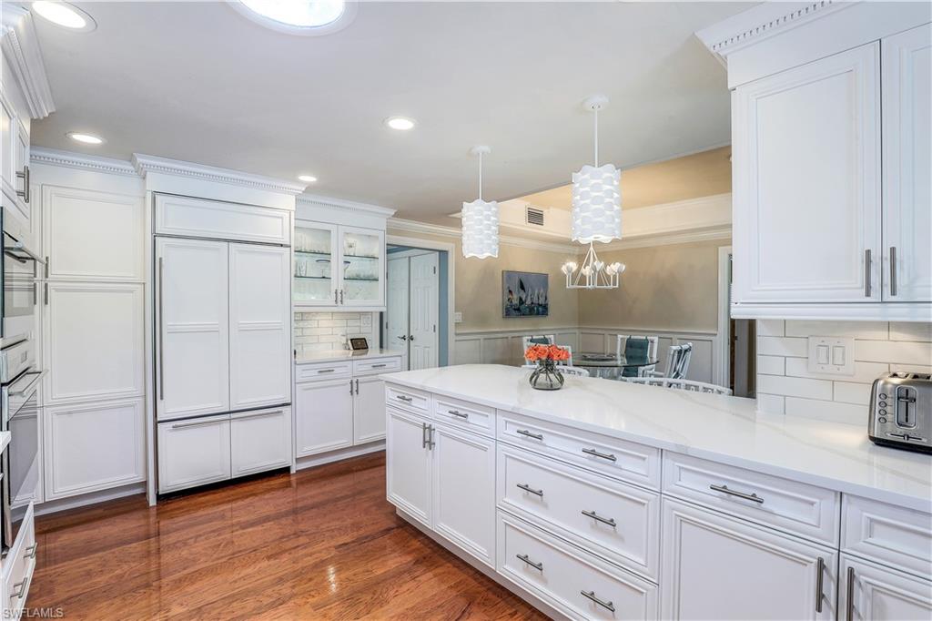 635 Anchor Rode Drive Naples, FL 34103 - Photo 15 of 50 a kitchen with stainless steel appliances granite countertop a refrigerator and a sink