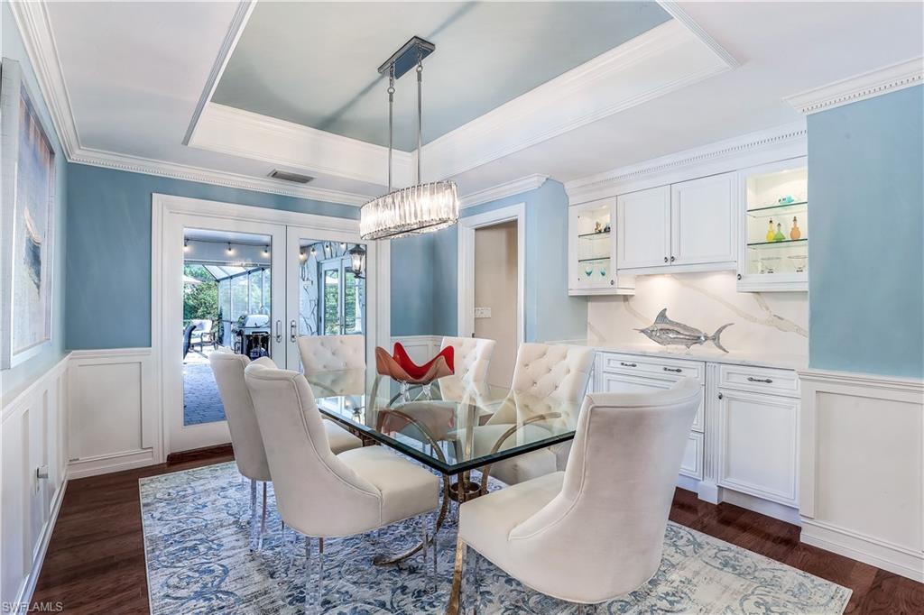 635 Anchor Rode Drive Naples, FL 34103 - Photo 20 of 50 a living room with furniture and a chandelier