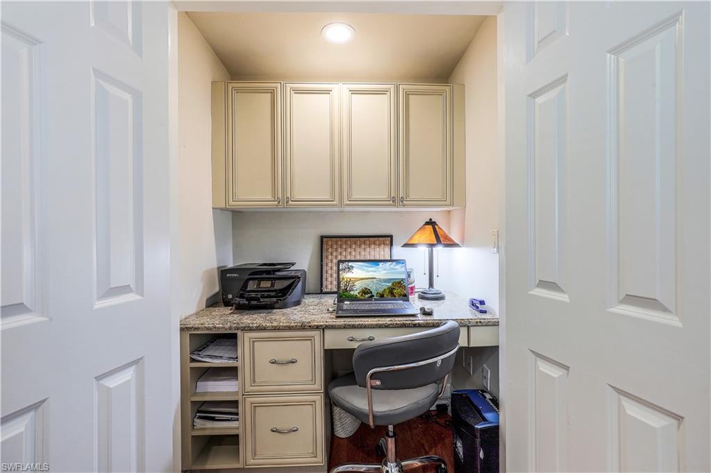 635 Anchor Rode Drive Naples, FL 34103 - Photo 31 of 50 a kitchen with stainless steel appliances a stove and white cabinets