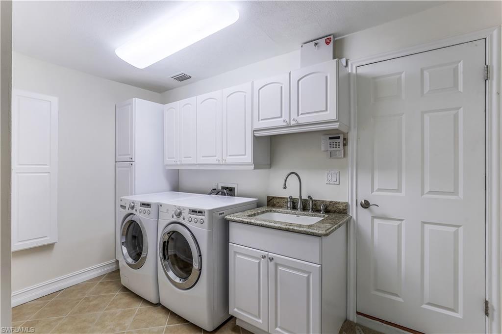 635 Anchor Rode Drive Naples, FL 34103 - Photo 33 of 50 a utility room with sink dryer and washer