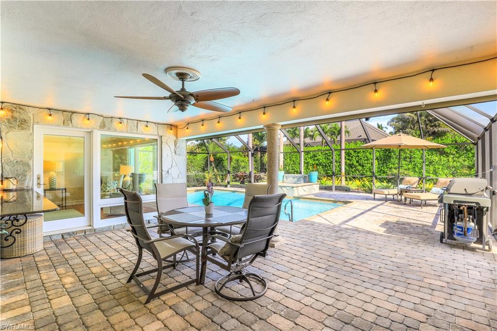 635 Anchor Rode Drive Naples, FL 34103 - Photo 34 of 50 a dining space with furniture and garden view