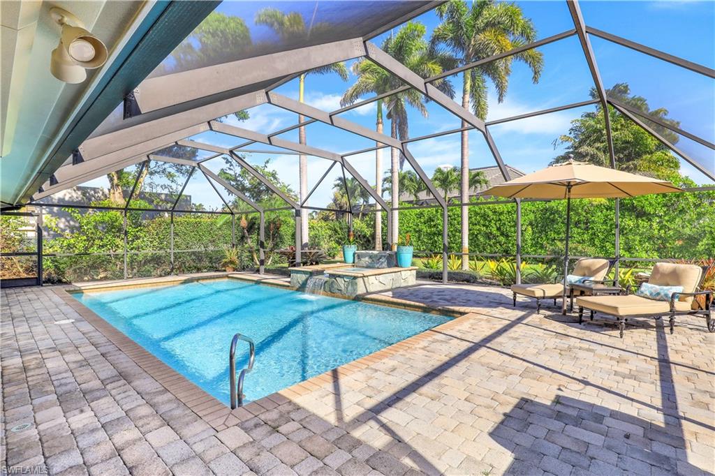 635 Anchor Rode Drive Naples, FL 34103 - Photo 38 of 50 a view of a backyard with a patio and swimming pool